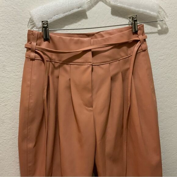Anthropologie BlankNYC Chelsea Tapered Faux Leather Pleated Adjustable Belt Pant - Picture 2 of 11